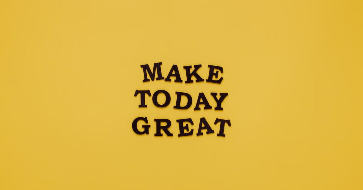 Simple and motivational quote 'Make Today Great' on a minimalist yellow background for inspiration.